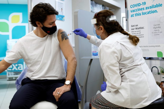 Canada's Prime Minister Justin Trudeau is inoculated with AstraZeneca's vaccine against coronavirus disease (COVID-19) at a pharmacy in Ottawa,