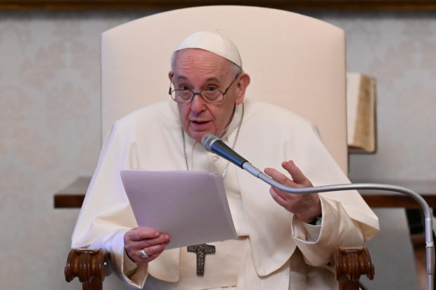 Pope Francis holds a weekly general audience in the library of the Apostolic Palace at the Vatican, April 28, 2021. 