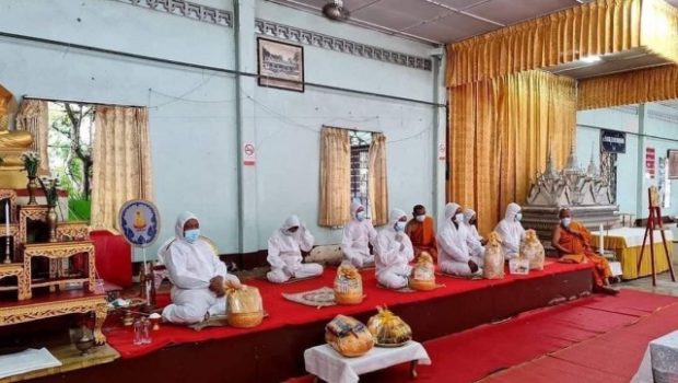 LOOK: Monks wear PPE suits to conduct funeral rituals