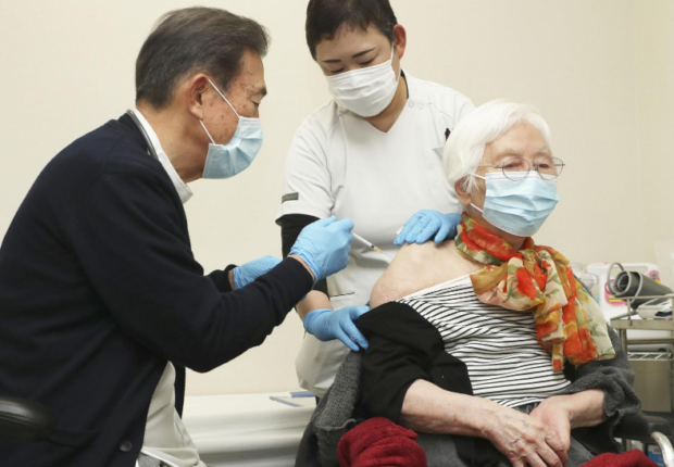 Japan begins COVID-19 shots for over 65s as fourth infection wave looms