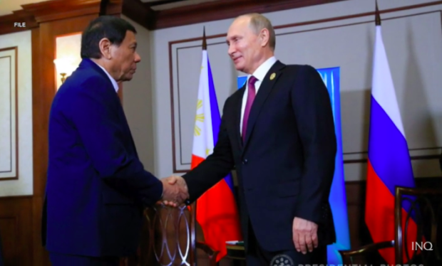 Rodrigo Duterte shakes hands with Vladimir Putin. STORY: Duterte says he’ll ask ‘friend’ Putin to control troops in Ukraine