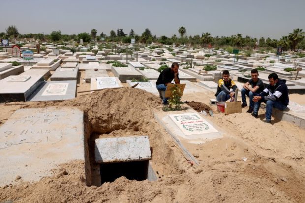 Gaza gravediggers and medics stretched as COVID-19 spikes during Ramadan