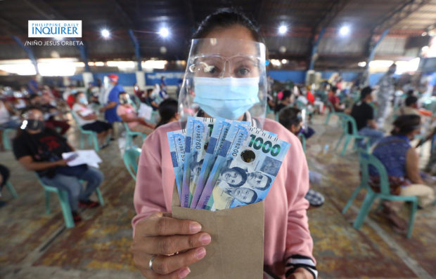 Impose social distancing, health rules during aid distribution, 'NCR Plus' LGUs told