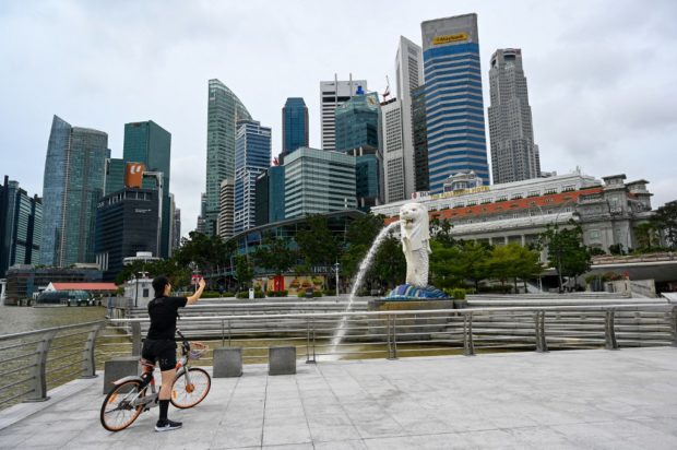 Singapore enforces 14-day quarantine for travelers from ...