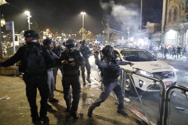 Israeli police and Palestinians clash for second night amid land rights