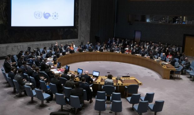 In this file photo taken on January 25, 2019 Diplomats gather for a United Nations Security Council meeting, addressing the impacts of climate-related disasters on international peace and security, at the United Nations in New York. - Non-permanent members of the UN Security Council on May 7, 2021 called for the number of permanent seats to be expanded, saying the current limit of five was outdated and undermined the organization. 