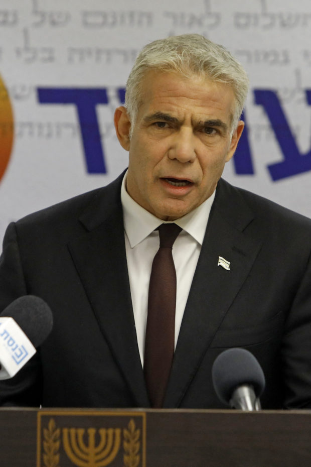 Opposition leader and Chairman of Israel's Yesh Atid party Yair Lapid speaks during a weekly party meeting at the Knesset in Jerusalem, on May 24, 2021. (Photo by Gil COHEN-MAGEN / AFP)