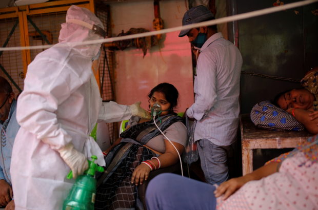A woman with a breathing problem receives oxygen support for free at a Gurudwara (Sikh temple), amidst the spread of coronavirus disease (COVID-19), in Ghaziabad, India, April 30, 2021