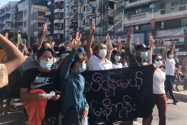 People protest in Hlaing Township, Yangon, Myanmar May 2, 2021, in this still image from a video obtained by Reuters.