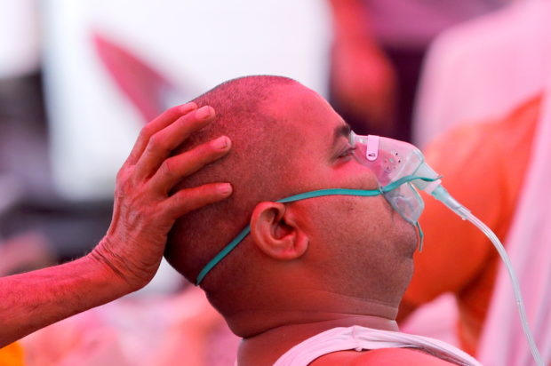 A man with a breathing problem receives oxygen support for free at a Gurudwara (Sikh temple), amidst the spread of coronavirus disease (COVID-19), in Ghaziabad, India, May 3, 2021