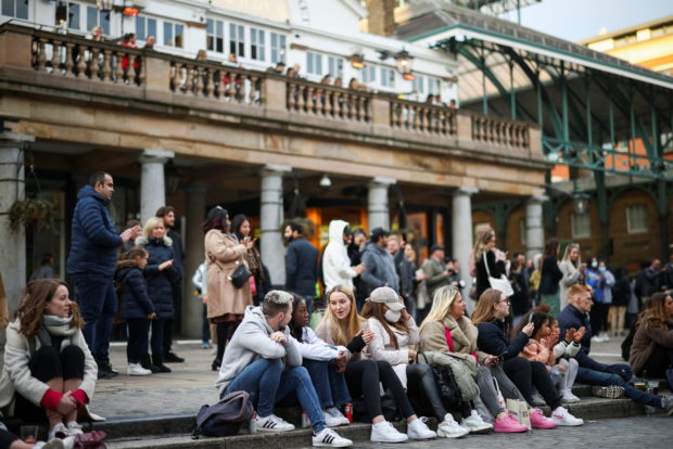 People gather in Covent Garden as the coronavirus disease (COVID-19) restrictions ease, in London, Britain, April 17, 2021