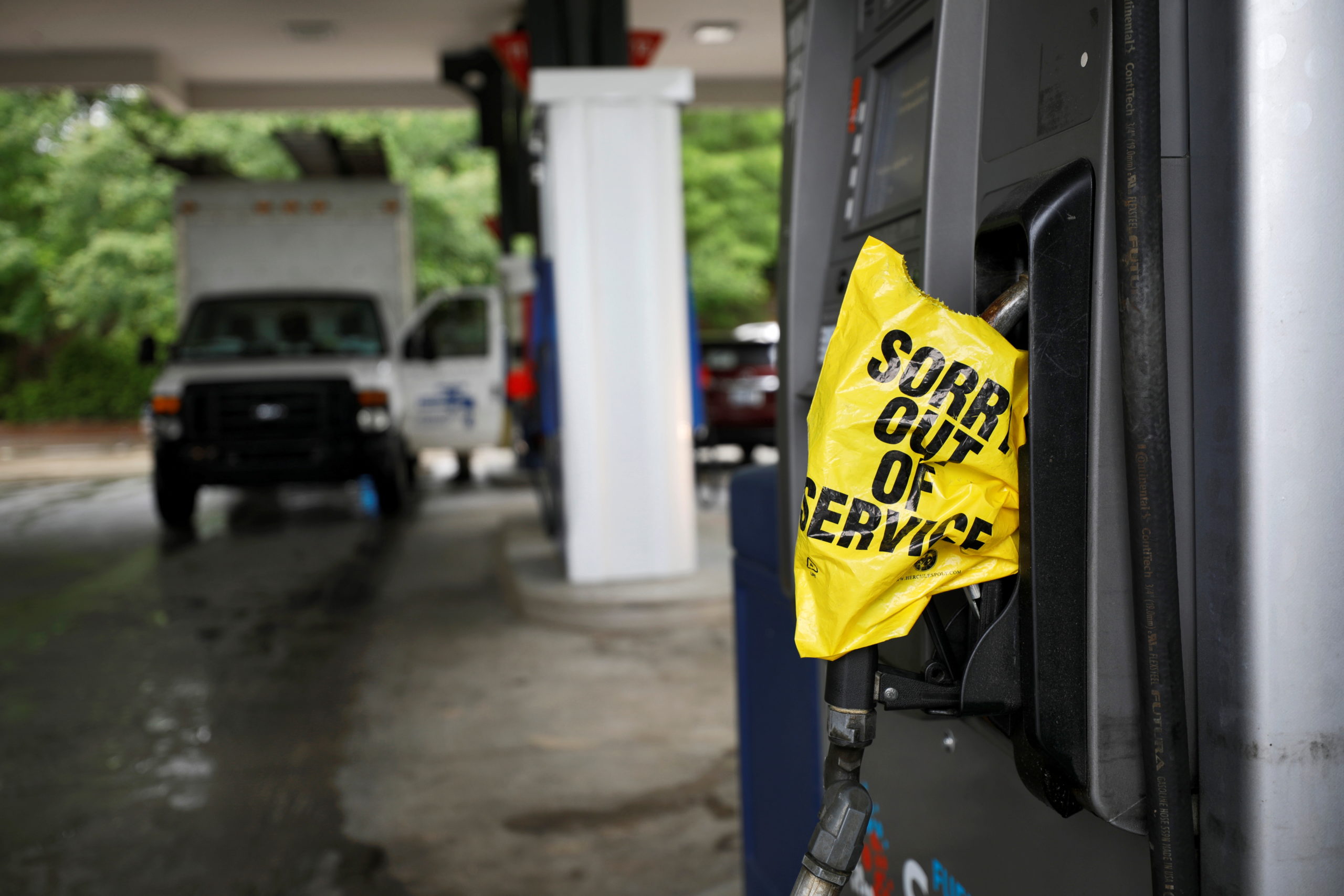 A bagged nozzle at a pump notifies motorists that it no longer has fuel after a cyberattack crippled the biggest fuel pipeline in the country, run by Colonial Pipeline, in Chapel Hill, North Carolina, U.S. May 12, 2021.  REUTERS/Jonathan Drake