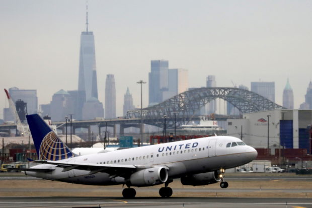 A United Airlines passenger jet takes off with New York City as a backdrop, at Newark Liberty International Airport, New Jersey, U.S. December 6, 2019. REUTERS/Chris Helgren/File Photo