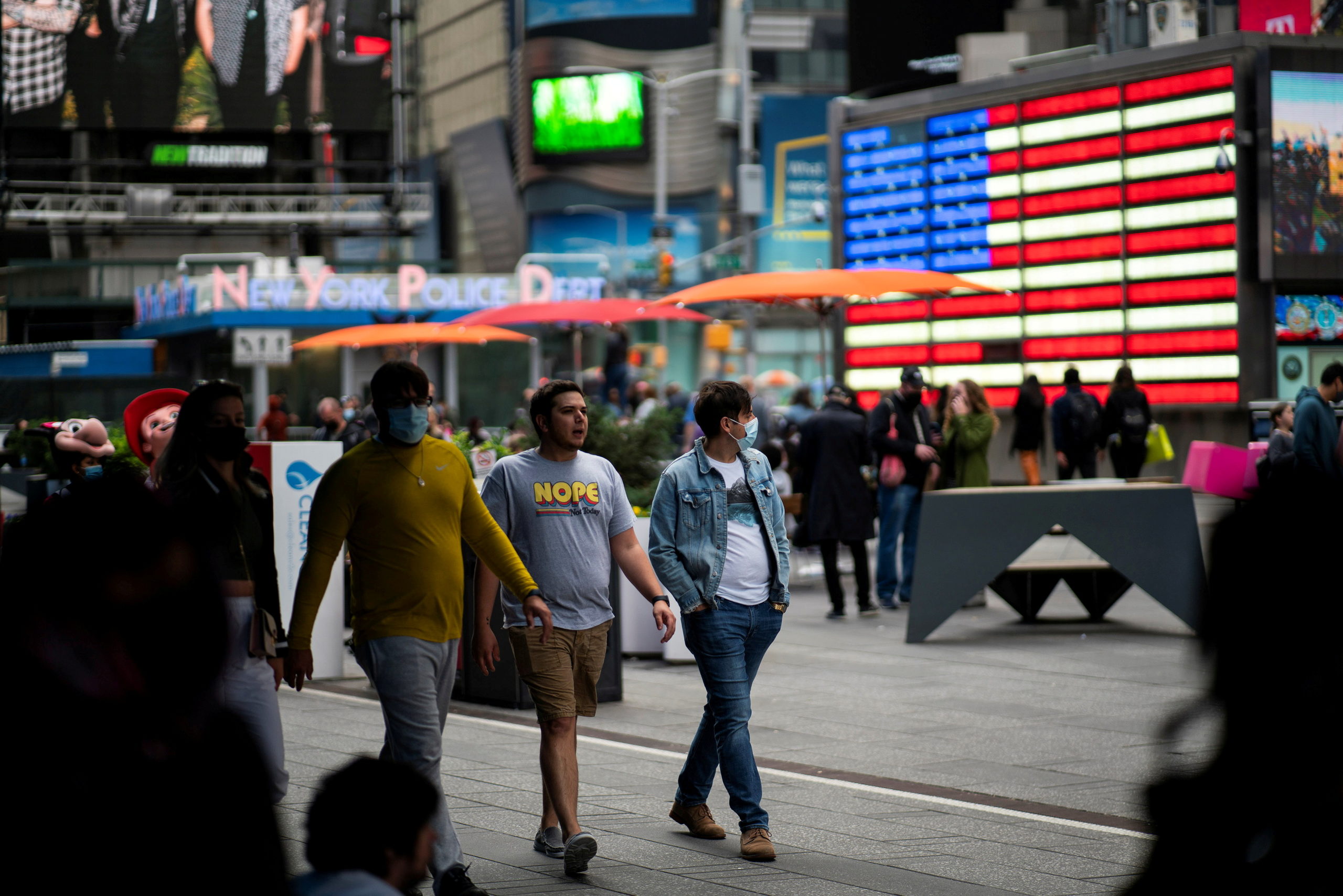 FILE PHOTO: People make their way through Times Square, amid the coronavirus disease (COVID-19) pandemic, in Manhattan, New York City, U.S., May 07, 2021. REUTERS/Eduardo Munoz/File Photo