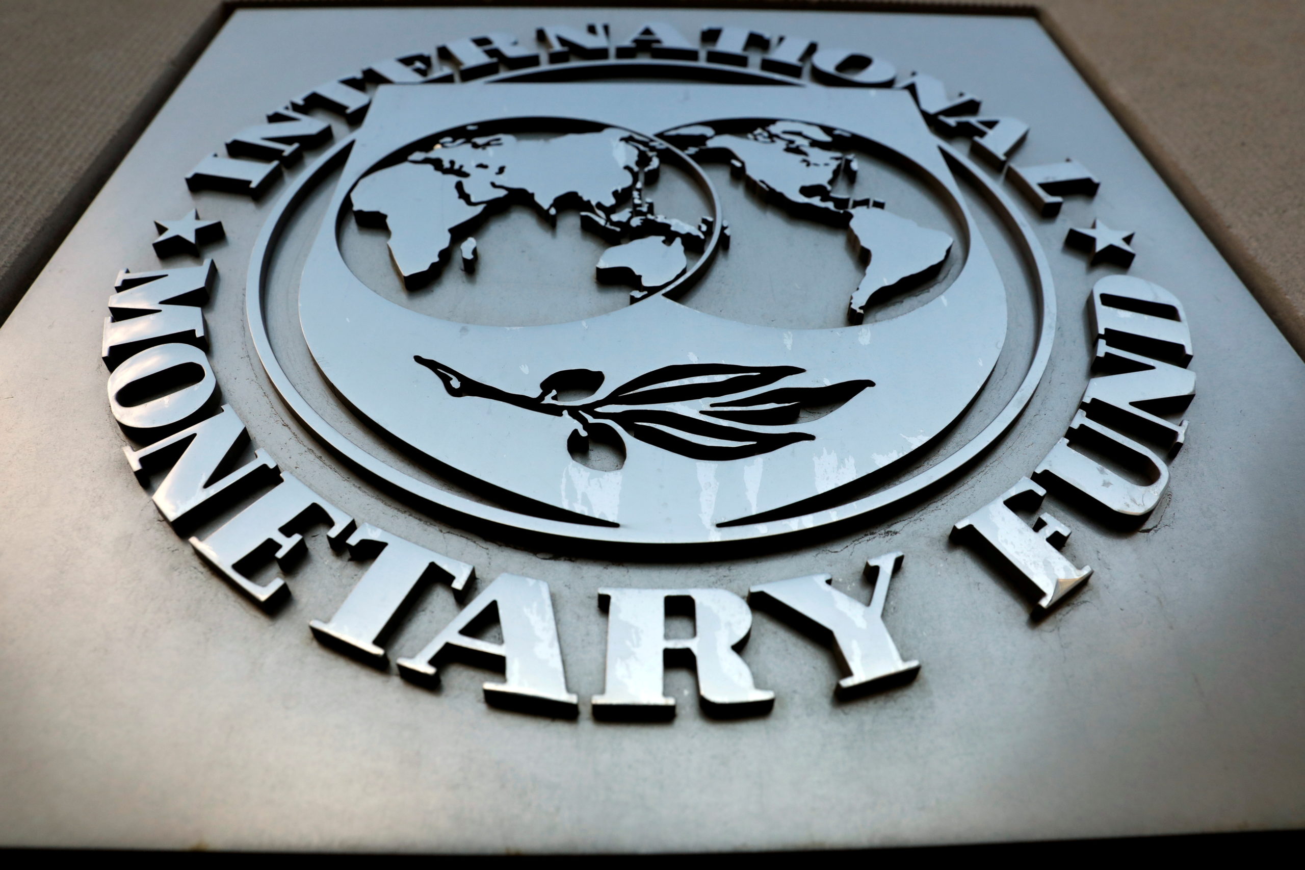 FILE PHOTO: The International Monetary Fund (IMF) logo is seen outside the headquarters building in Washington, United States, September 4, 2018. REUTERS/Yuri Gripas