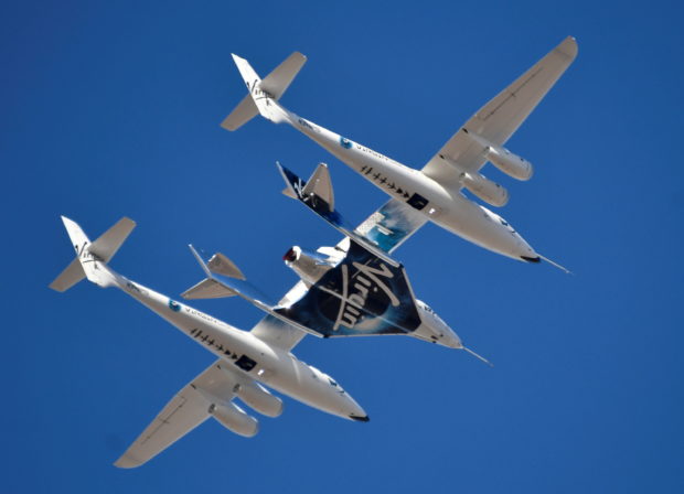 Virgin Galactic rocket plane, the WhiteKnightTwo carrier airplane, with SpaceShipTwo passenger craft takes off from Mojave Air and Space Port in Mojave, California, U.S., February 22, 2019. REUTERS/Gene Blevins/File Photo