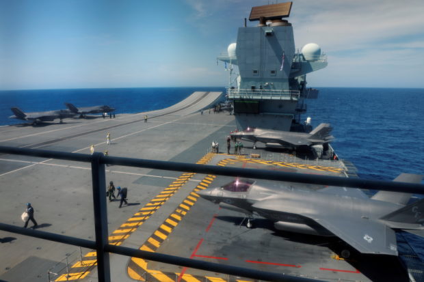 Lightning II aircrafts are seen on the deck of the HMS Queen Elizabeth aircraft carrier offshore Portugal