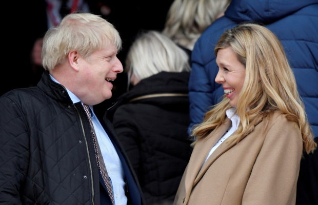 Rugby Union - Six Nations Championship - England v Wales - Twickenham Stadium, London, Britain - March 7, 2020  Britain's Prime Minister Boris Johnson with his partner Carrie Symonds before the match   REUTERS/Toby Melville