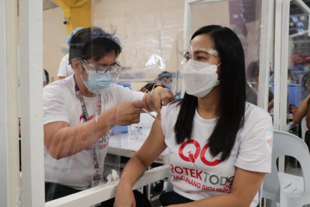 Quezon City mayor Joy Belmonte gets her first dose of Sinovac vaccine on May 24, 2021. 