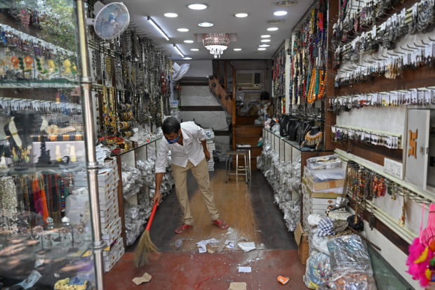 Delhi, Mumbai loosen lockdowns as India virus crisis eases in cities