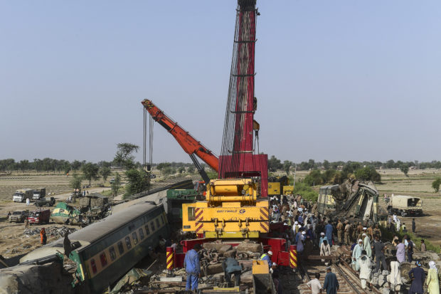 Toll rises from deadly Pakistan train crash as rescuers comb through wreckage