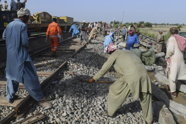 Engineers reopen track after deadly Pakistani train crash