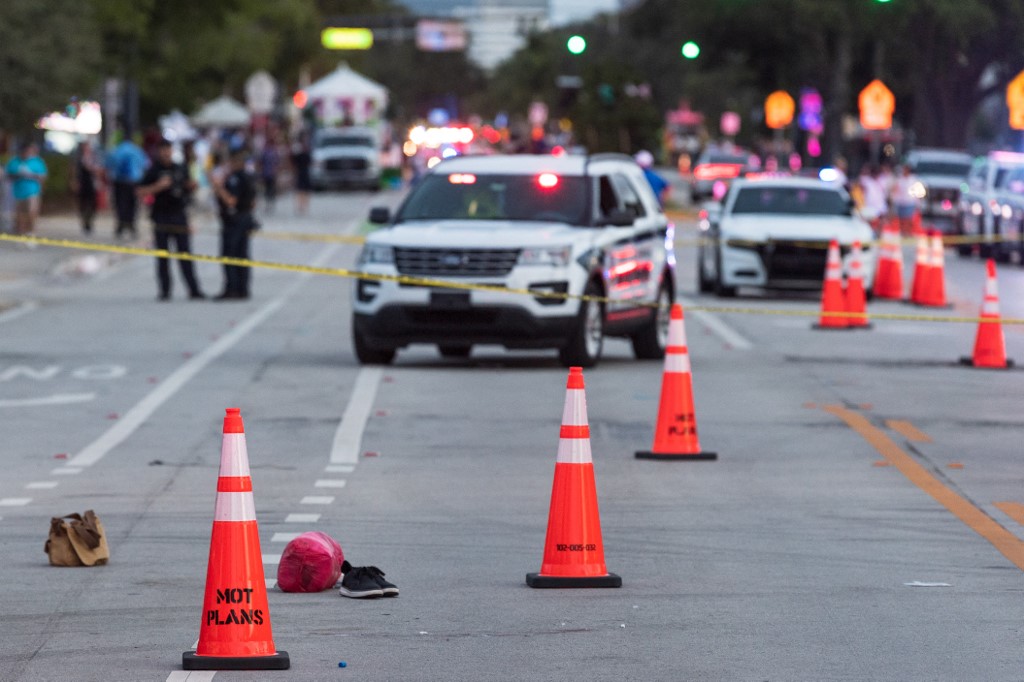 WILTON MANORS, FLORIDA - JUNE 19: Police investigate the scene where a pickup truck drove into a crowd of people at a Pride parade on June 19, 2021 in Wilton Manors, Florida. One person died and one was injured in the incident that is still under investigation. Jason Koerner/Getty Images/AFP (Photo by Jason Koerner / GETTY IMAGES NORTH AMERICA / Getty Images via AFP)