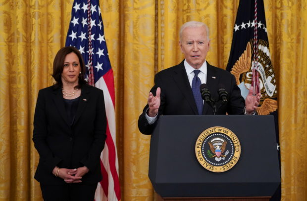 U.S. President Joe Biden speaks next to U.S. Vice President Kamala Harris before signing the COVID-19 Hate Crimes Act into law, in the East Room at the White House in Washington, U.S., May 20, 2021
