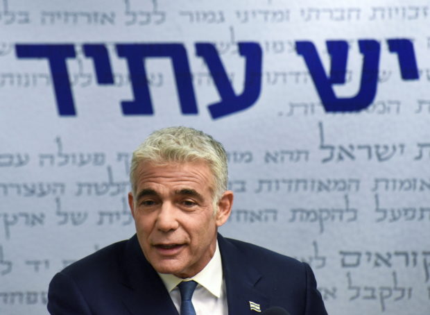 Yair Lapid, head of the centrist Yesh Atid party, delivers a statement to the press before the party faction meeting at the Knesset, Israel's parliament, in Jerusalem May 31, 2021. Debbie Hill/Pool via REUTERS