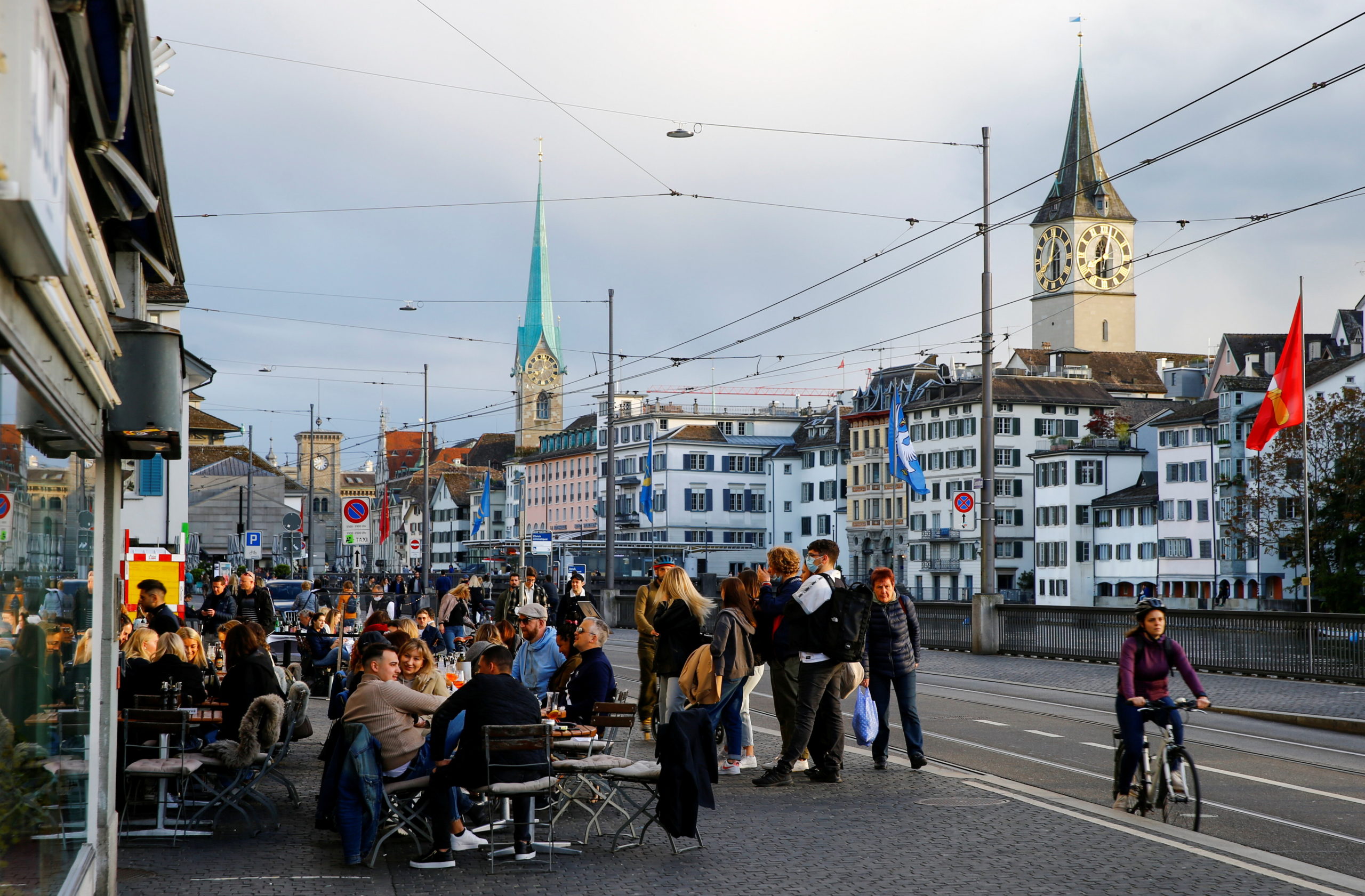 FILE PHOTO: Guests sit outside of a restaurant, as the spread of the coronavirus disease (COVID-19) continues, in the old town of Zurich, May 22, 2021. Picture taken May 22, 2021.  REUTERS/Arnd Wiegmann/File Photo switzerland covid-19 certificate