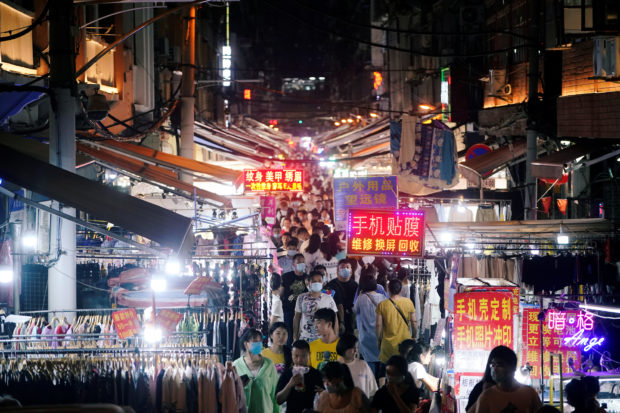 People visit a street market, following the coronavirus disease (COVID-19) outbreak, in Wuhan, Hubei province, China September 2, 2020. 