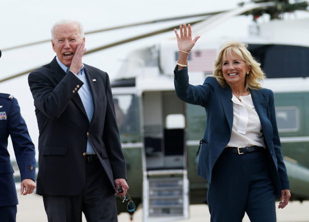 U.S. President Joe Biden pauses with first lady Jill Biden prior to boarding Air Force One as they depart on travel to attend the G-7 Summit in England, the first foreign trip of his presidency, from Joint Base Andrews, Maryland, U.S., June 9, 2021. REUTERS/Kevin Lamarque