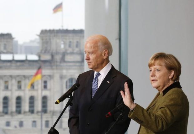 German Chancellor Merkel and U.S. Vice President Biden leave after statement in Berlin