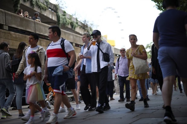 People walk along the South Bank, amid the coronavirus disease (COVID-19) outbreak, in London