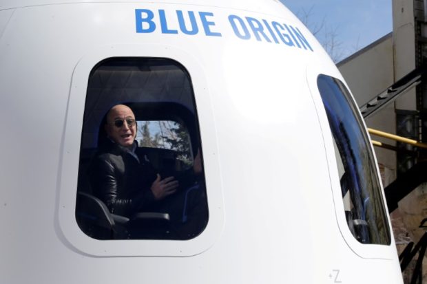 Amazon and Blue Origin founder Jeff Bezos addresses the media about the New Shepard rocket booster and Crew Capsule mockup at the 33rd Space Symposium in Colorado Springs, Colorado, United States April 5, 2017.  REUTERS/Isaiah J. Downing/File Photo/File Photo
