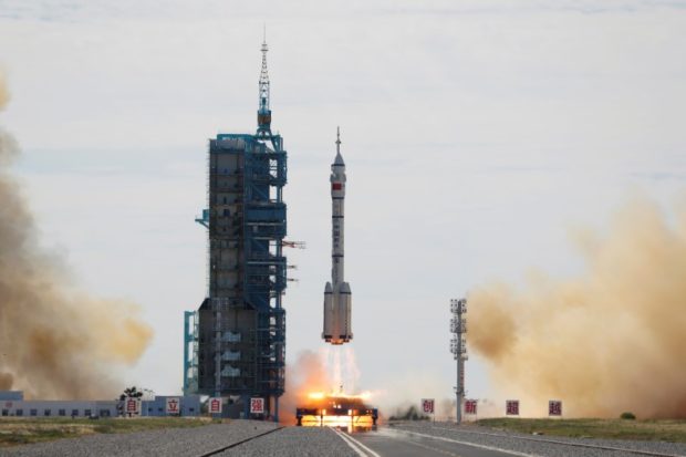 he Long March-2F Y12 rocket, carrying the Shenzhou-12 spacecraft and three astronauts, takes off from Jiuquan Satellite Launch Center for China's first manned mission to build its space station, near Jiuquan, Gansu province, China June 17, 2021. REUTERS/Carlos Garcia Rawlins