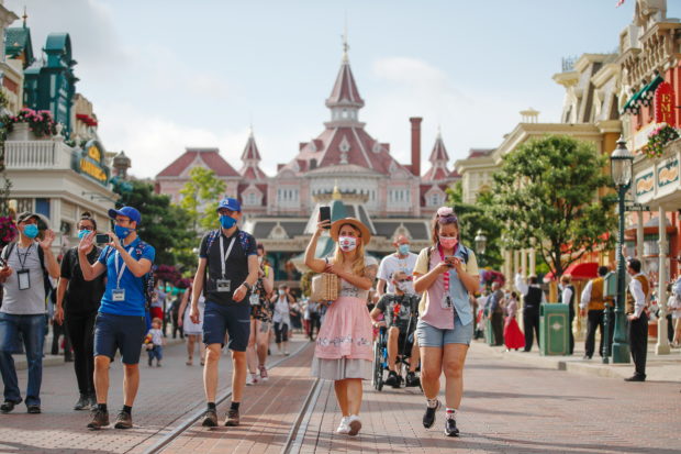 Disneyland Paris reopens, but Mickey Mouse won't give hugs