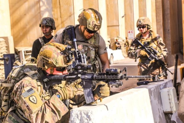 FILE PHOTO: U.S. Army soldiers man a defensive position at Forward Operating Base Union III in Baghdad