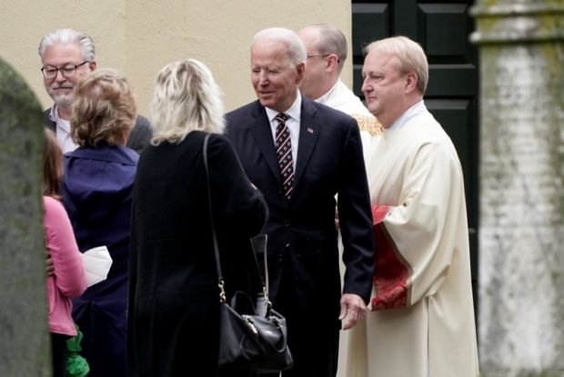U.S. President Joe Biden speaks with people outside St. Joseph on the Brandywine Catholic Church, in Wilmington, Delaware, U.S. May 30, 2021. REUTERS/Ken Cedeno/File Photo