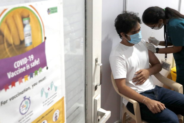 A man receives a dose of COVISHIELD, a coronavirus disease (COVID-19) vaccine manufactured by Serum Institute of India, at a vaccination centre in Mumbai, India, May 1, 2021