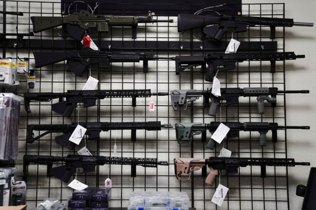 AR-15 style rifles are displayed for sale at Firearms Unknown, a gun store in Oceanside, California, U.S., April 12, 2021. REUTERS/Bing Guan/File Photo