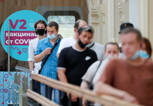 People line up to receive vaccine amid the outbreak of the coronavirus disease in central Moscow
