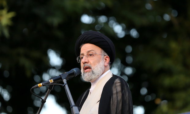 Presidential candidate Ebrahim Raisi speaks during a campaign rally in Tehran
