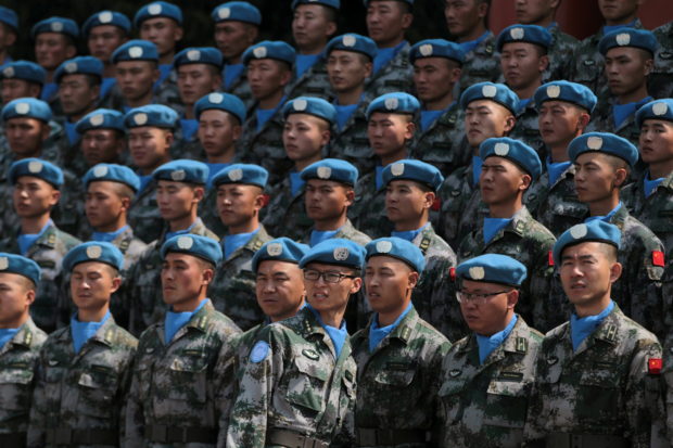 Chinese peacekeepers participate in an oath-taking rally before leaving to join the UN peacekeeping operations in Lebanon, in Yuxi, Yunnan