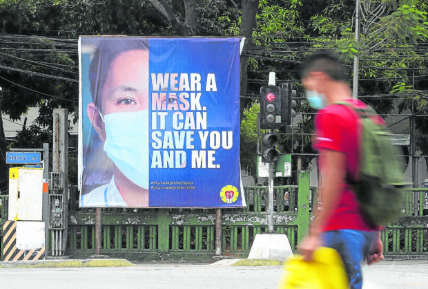 Tarpaulin sign reminding public to wear face masks. STORY: Be ready for new Omicron subvariants – health expert