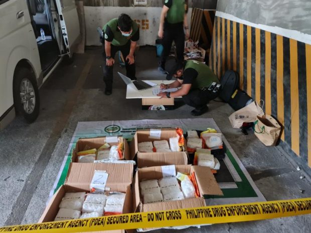 CAPTION: PDEA operatives conducting an inventory after a buy-bust operation which led to the arrest of a Chinese national and confiscation of 15 kilos of crystal meth worth more than 100 million. Photo courtesy PDEA PIO