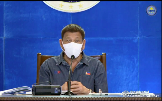 SMALL INCONVENIENCE President Rodrigo Duterte apologizes for the confusion over the national government's face shield policy during his public address Monday night after holding a meeting with the Inter-Agency Task Force on the Emerging Infectious Diseases (IATF-EID) core members at the Arcadia Active Lifestyle Center in Matina, Davao City on June 21, 2021. Duterte was not wearing a face shield. Image from PCOO