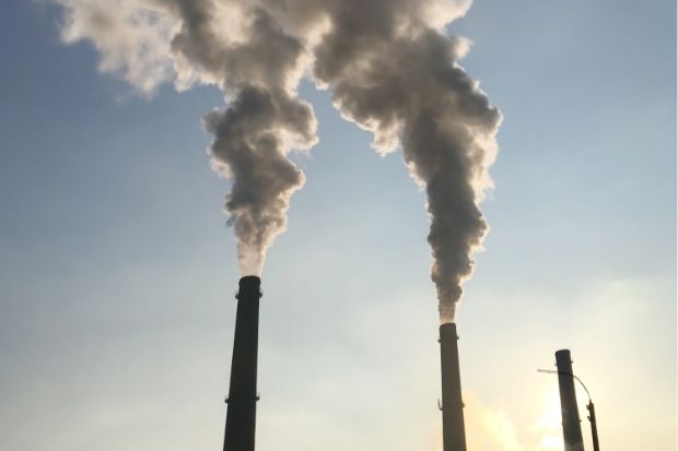 Factory chimneys emitting smoke. STORY: ‘Window closing’ on climate mitigation efforts – report