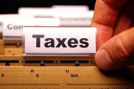 Stock photo of folders with one marked "Taxes"