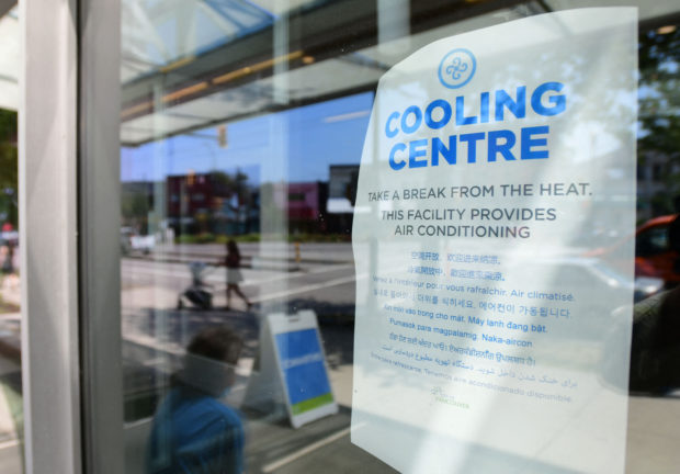 A welcoming sign is seen on the door of the Hillcrest Community Centre where they can cool off during the extreme hot weather in Vancouver, British Columbia, Canada, June 30, 2021. - Inside one of Vancouver's 25 air-conditioned cooling centres on Wednesday, visitors quietly read books or worked on laptops as the death toll in Canada's British Columbia province rose into the hundreds from a record-smashing heat wave. "We've had heat waves before, but not to this extent," said Lou, who provided only her first name. "I'm shocked by how many deaths there have been." (Photo by Don MacKinnon / AFP)